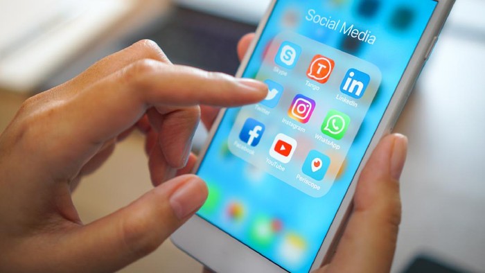 Bangkok, Thailand - JUN 18, 2018: social medial app iPhone mobile phone with blue screen background technology business smartphone digital communication facebook and internet editorial