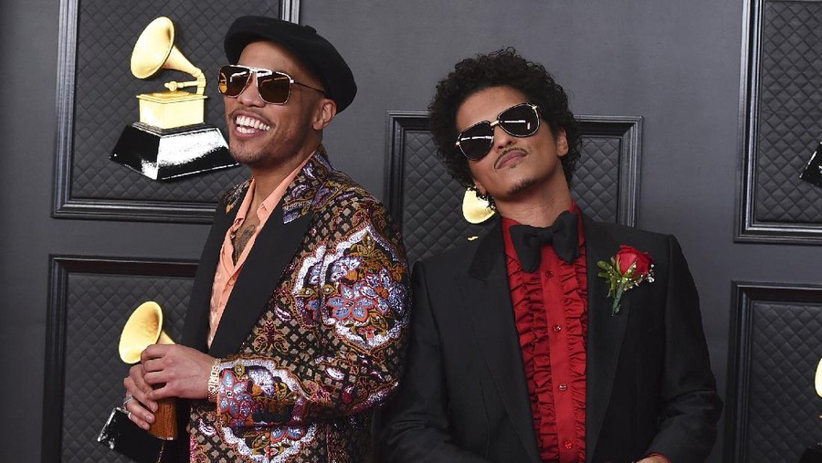 FILE - Anderson .Paak, left, and Bruno Mars, of the duo Silk Sonic, appear at the 63rd annual Grammy Awards in Los Angeles on March 14, 2021. The duo earned four Grammy nominations including record of the year, song of the year, best R&B song and best R&B performance.(Photo by Jordan Strauss/Invision/AP, File)