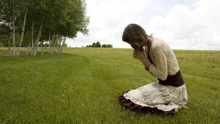 A young woman praying.Similar Images: