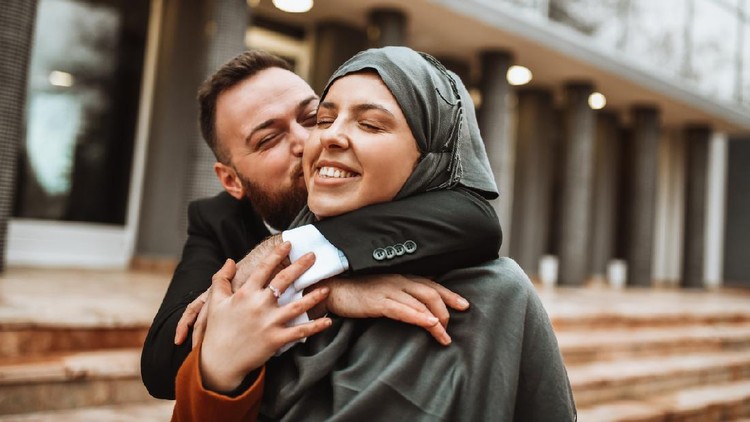 Modern Muslim Male Kissing Beautiful Wife Wearing Hijab Outside