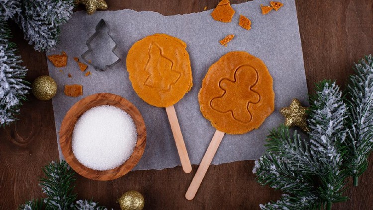 Korean dalgona sugar candy cookie or ppopgi. Honeycomb toffee with Christmas decorated