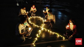 FOTO: Cahaya Temaram di Malam Renungan Hari AIDS Sedunia