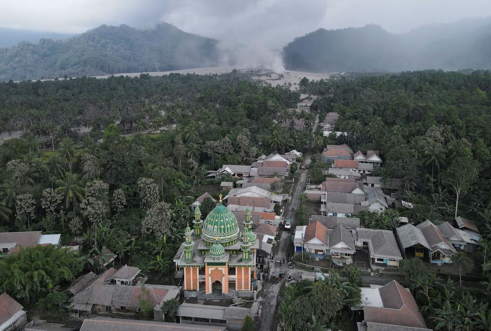 An aerial view of Sumber Wuluh village covered with volcanic ash following the eruption of Mount Semeru volcano in Lumajang regency, East Java province, Indonesia, December 5, 2021. Picture taken with a drone. REUTERS/Willy Kurniawan