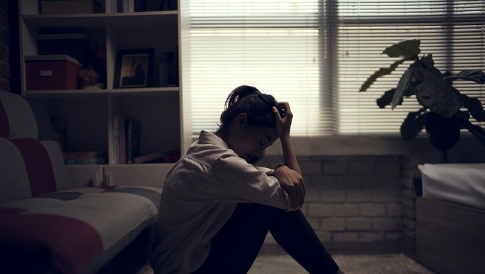 Business woman is depressed. She felt stressed and alone in the house.