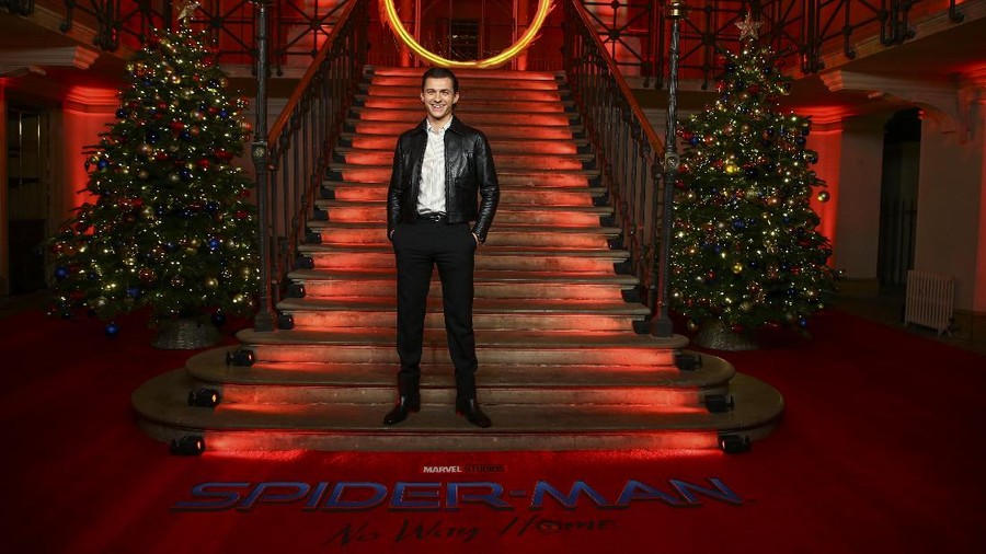 Tom Holland poses for photographers at the photo call for the film 'Spider-Man: No Way Home' in London Sunday, Dec. 5, 2021. (Photo by Joel C Ryan/Invision/AP)