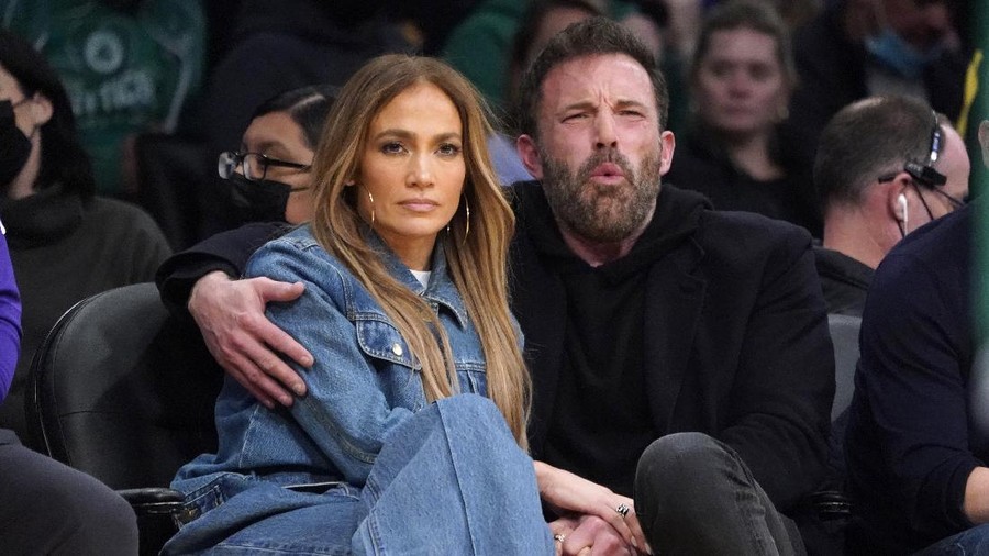 Jennifer Lopez, left, and Ben Affleck attend an NBA basketball game between the Los Angeles Lakers and the Boston Celtics Tuesday, Dec. 7, 2021, in Los Angeles. (AP Photo/Marcio Jose Sanchez)