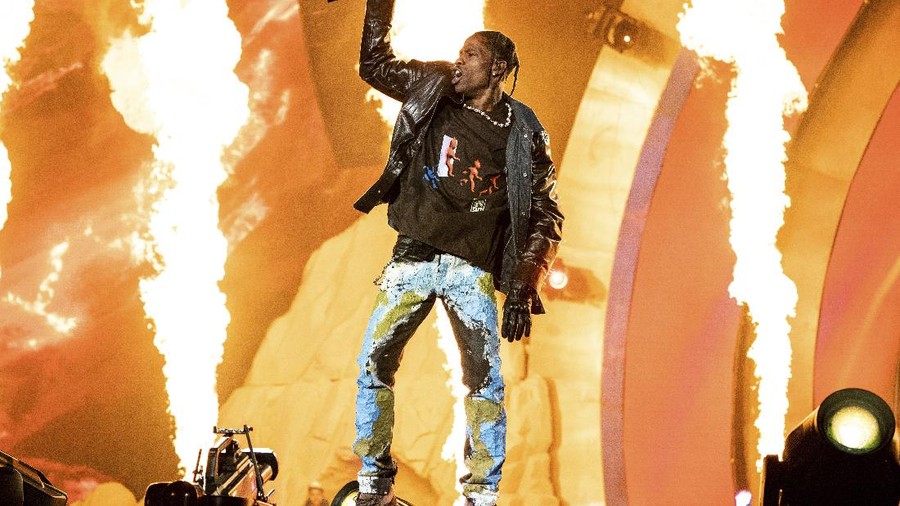 FILE - Travis Scott performs at the Astroworld Music Festival in Houston on Nov. 5, 2021.  Scott said he didn't know that fans had died at his Astroworld festival until after his performance ended. In an interview with Charlamagne Tha God posted on Thursday, Dec. 9, Scott said he paused the performance a couple of times, but couldn't hear fans screaming for help.  (Photo by Amy Harris/Invision/AP, File)