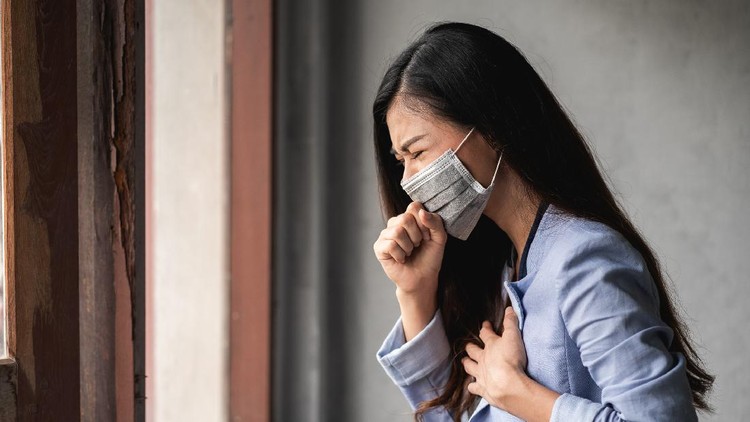 1218109128 COVID-19 Pandemic Coronavirus, Asian woman wearing a mask, have a symptoms coughing and fever