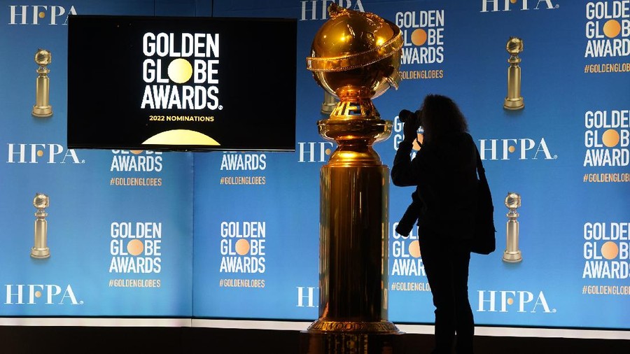 A photographer shoots a Golden Globe statue at the nominations event for 79th annual Golden Globe Awards at the Beverly Hilton Hotel on Monday, Dec. 13, 2021, in Beverly Hills, Calif. The 79th annual Golden Globe Awards will be held on Sunday, Jan. 9, 2022. (AP Photo/Chris Pizzello)