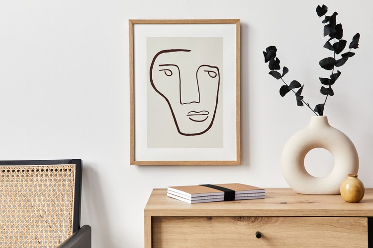 Stylish interior of living room with mock up poster frame, furniture and elegant personal accessories. Minimalist concept of home decor. Template.