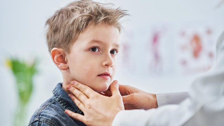 Picture of little boy having medical examination by pediatrician