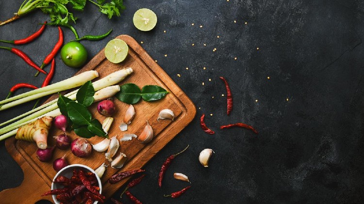 Vegetables healthy food herbs and spices on a cutting board. Raw materials of cooking preparation Tom Yum.