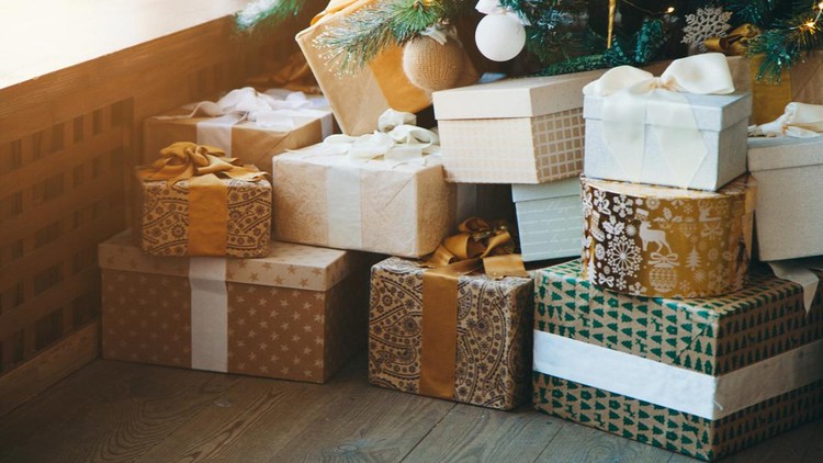 holidays, New year, decor and celebration concept - a large Christmas tree with gifts . new year's interior