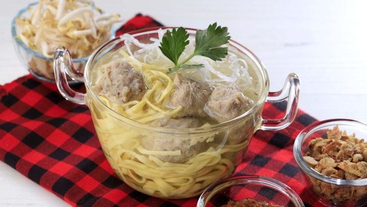 Mie Bakso. A Popular Indonesian Comfort Street Food of Meatballs and Noodles Soup with Fresh Vegetable.