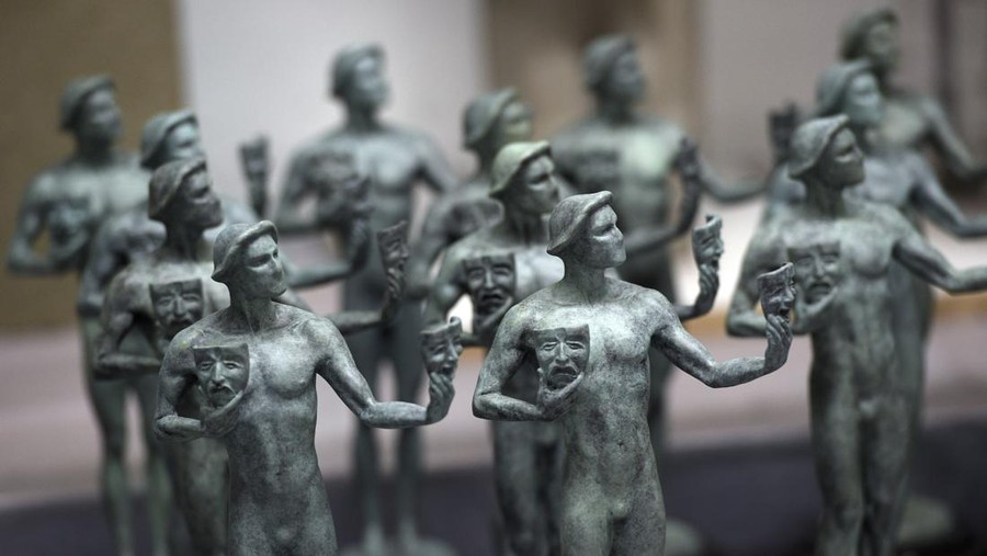 FILE - Finished solid bronze Actor statuettes are displayed during the 25th Annual Casting of the Screen Actors Guild Awards at American Fine Arts Foundry, Tuesday, Jan. 15, 2019, in Burbank, Calif.  The 2022 SAG Awards are scheduled to take place on Feb. 27. (Photo by Chris Pizzello/Invision/AP, File)