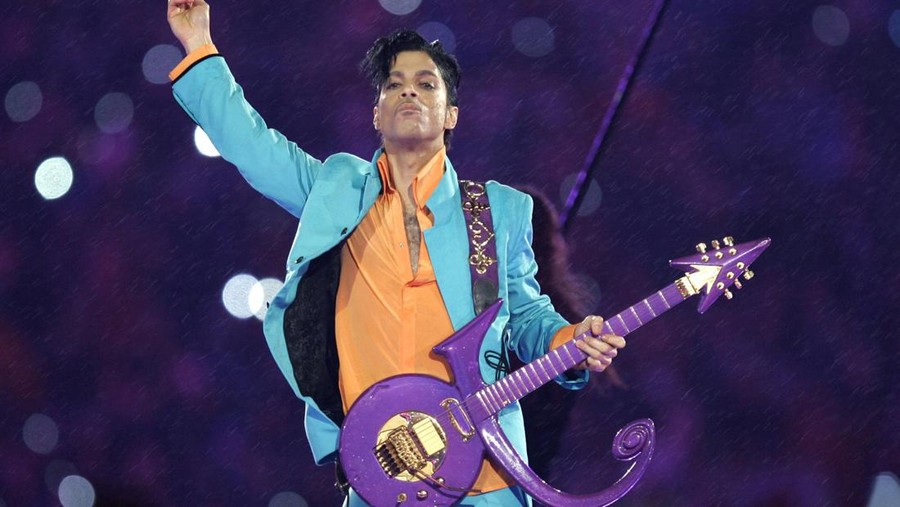 FILE - In this Feb. 4, 2007, file photo, Prince performs during the halftime show at the Super Bowl XLI football game in Miami. The six-year legal battle over pop superstar Prince’s estate has ended, meaning the process of distributing the artist's wealth could begin in February 2022. (AP Photo/Chris O'Meara, File)