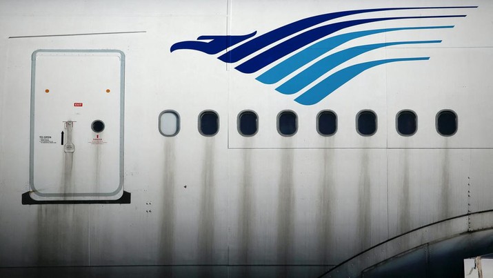 The Garuda Indonesia's sign is seen on its aeroplane parked at the Garuda Maintenance Facility (GMF) AeroAsia, at Soekarno-Hatta International airport near Jakarta, Indonesia, January 21, 2022. REUTERS/Willy Kurniawan