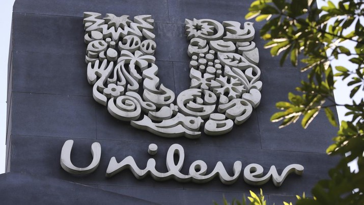 FILE - A view of a Unilever logo, displayed outside the head office of PT Unilever Indonesia Tbk. in Tangerang, Indonesia, Tuesday, Nov. 16, 2021. Unilever, which makes Vaseline skin care products and Ben & Jerry’s ice cream, says it's laying off 1,500 staff as part of a company-wide restructuring. The proposed changes mean that senior management jobs will be cut by about 15% while junior management roles will be reduced by 5%, it said Tuesday Jan. 25, 2022. The London-based consumer goods giant employs 149,000 people globally.  (AP Photo/Tatan Syuflana, FIle)