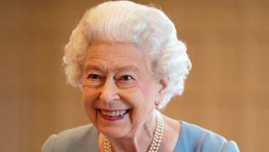 Britain's Queen Elizabeth II smiles during a reception in the Ballroom of Sandringham House, the Queen's Norfolk residence on February 5, 2022, as she celebrates the start of the Platinum Jubilee. - Queen Elizabeth II on Sunday will became the first British monarch to reign for seven decades, in a bittersweet landmark as she also marked the 70th anniversary of her father's death. (Photo by Joe Giddens / POOL / AFP)