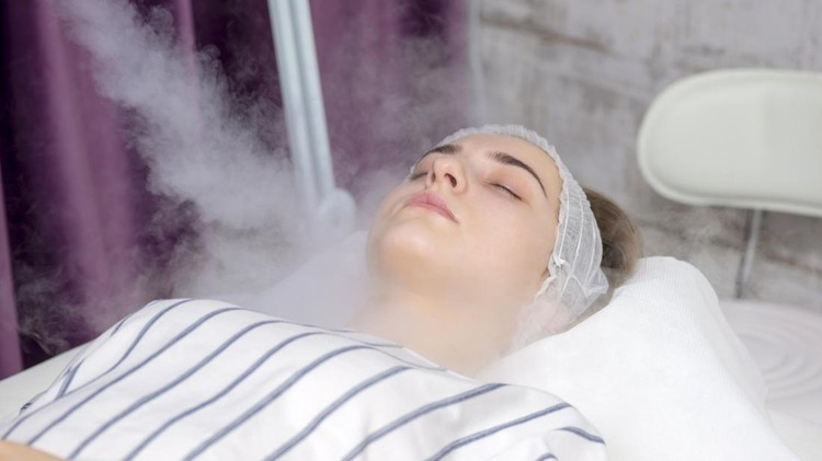 Beauty treatment of young female face, ozone facial steamer