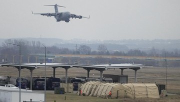 U.S. Army troops of the 82nd Airborne Division unloading vehicles from a transport plane after arriving from Fort Bragg at the Rzeszow-Jasionka airport in southeastern Poland, on Sunday, Feb. 6, 2022. Additional U.S. troops are arriving in Poland after President Joe Biden ordered the deployment of 1,700 soldiers here amid fears of a Russian invasion of Ukraine. Some 4,000 U.S. troops have been stationed in Poland since 2017. (AP Photo/Czarek Sokolowski)