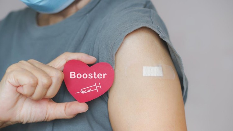 senior woman show red heart shape with syringe icon,  after vaccinated or inoculation  booster dose  due to spread of corona virus, population, social or herd immunity concept