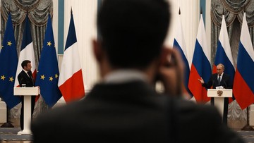 Russian President Vladimir Putin, right, listens during a joint press conference with French President Emmanuel Macron after their talks Monday, Feb. 7, 2022 in Moscow. Russian President Vladimir Putin was back at the Kremlin in Moscow following his diplomatic foray to get support from China over the weekend during the Winter Olympics. Putin was hosting the prime meeting of the day Monday as his French counterpart Emmanuel Macron was on a mission to de-escalate tensions. (AP Photo/Thibault Camus, Pool)