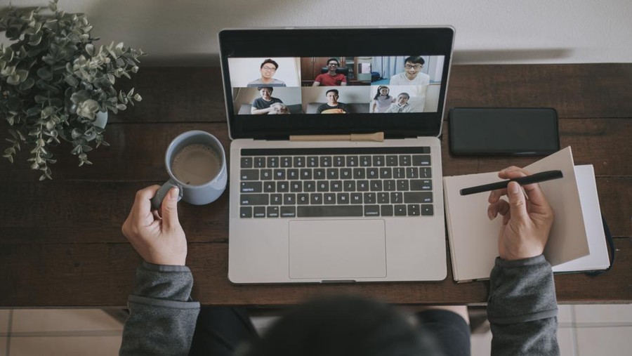 PPKM Level 3 WFH, Ini Ketentuan Inmendagri Terbaru An asian chinese male working at home using laptop video conference call meeting