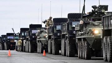 UKRAINE-CRISIS/GERMANY-USA TROOPS A soldier of the U.S. 2nd Cavalry Regiment stands in a combat vehicle as gear is prepared for deployment to Romania at Rose Barracks in Vilseck, Germany, February 9, 2022. REUTERS/Lukas Barth