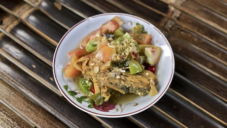 Blurry Tasty Ayam Garang Asem. Sour Soup Chicken Dish.