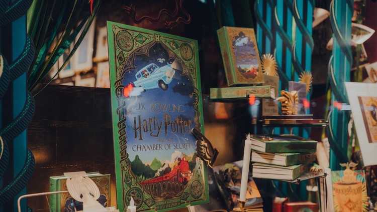 London, UK - November 23, 2021: Harry potter books in the window of MinaLima, the design studio behind the graphic props of the Harry Potter and Fantastic Beasts films, in Covent Garden, London.