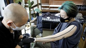 FOTO: Pilpres dan Nasib Label 'Tabu' Tato di Korea Selatan