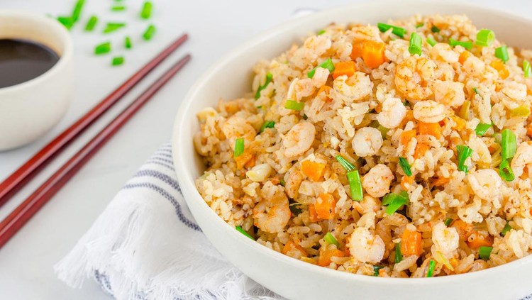 nasi goreng Chinese Shrimp Fried Rice, Popular Chinese Take Out Food, in a Bowl with Chopsticks and Soy Sauce