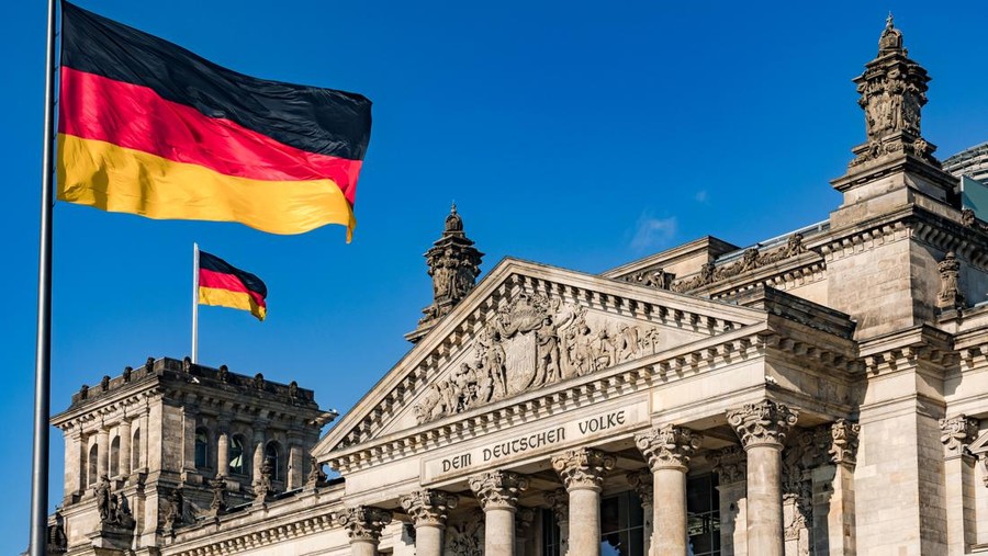 The german Reichstag with a dedication to the people in the German capital Berlin