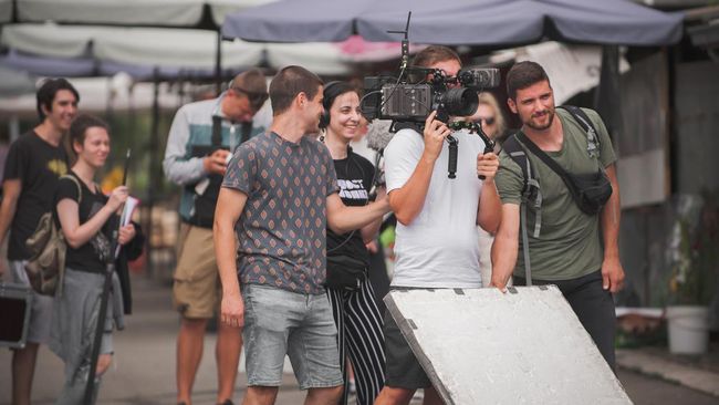 Behind the scenes. Film crew team shooting movie.