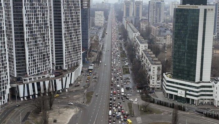 Cars line up waiting to get gasoline outside a gas station in Severodonetsk, the Donetsk region, eastern Ukraine, Thursday, Feb. 24, 2022. Russia launched a wide-ranging attack on Ukraine on Thursday, hitting cities and bases with airstrikes or shelling, as civilians piled into trains and cars to flee. (AP Photo/Ricard Garcia Vilanova)
