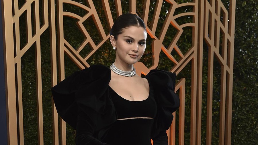 Selena Gomez, left, and Martin Short present the award for outstanding performance by a female actor in a supporting role at the 28th annual Screen Actors Guild Awards at the Barker Hangar on Sunday, Feb. 27, 2022, in Santa Monica, Calif. (AP Photo/Chris Pizzello)