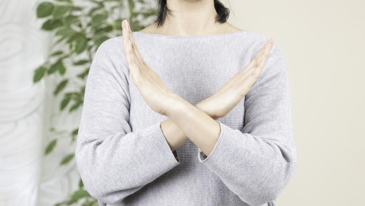 Crossed hands. Break the bias symbol of woman's international day. Woman arms crossed to show solidarity, commitment to calling out bias, breaking stereotypes, inequality, rejecting discrimination.
