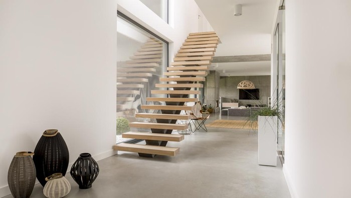Wooden minimalistic stairs in pure big space