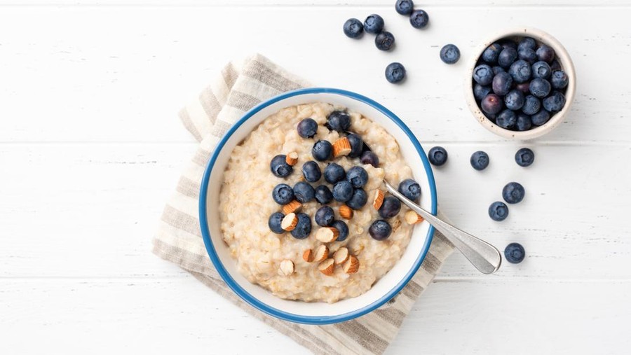 Oatmeal Porridge With Blueberries, Almonds In Bowl. Top View Copy Space For Text. Healthy Eating, Healthy Lifestyle, Eating Good Food Concept