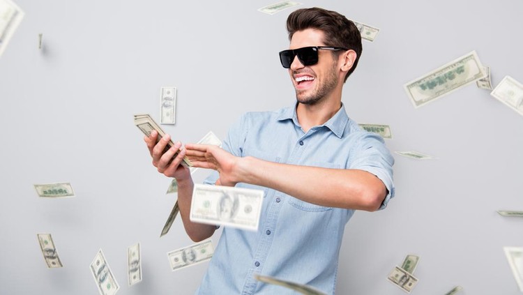 Ilustasi kaya Photo of cheerful excited ecstatic overjoyed man throwing money away, showing his wealthiness wearing denim isolated over grey color background