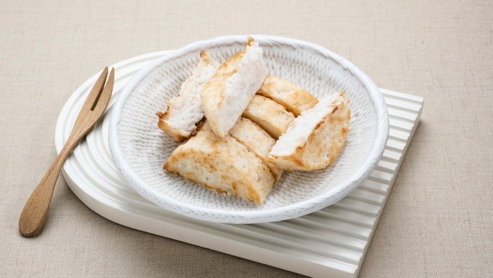 Kue Pancong, Gandos or Bandros is an Indonesian traditional snack made from a mixture of rice flour, grated coconut, and coconut milk.