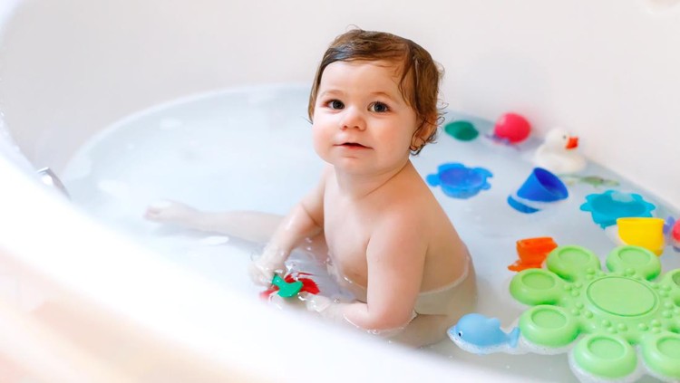 cute baby girl taking bath
