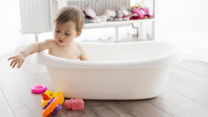 cute baby girl taking bath