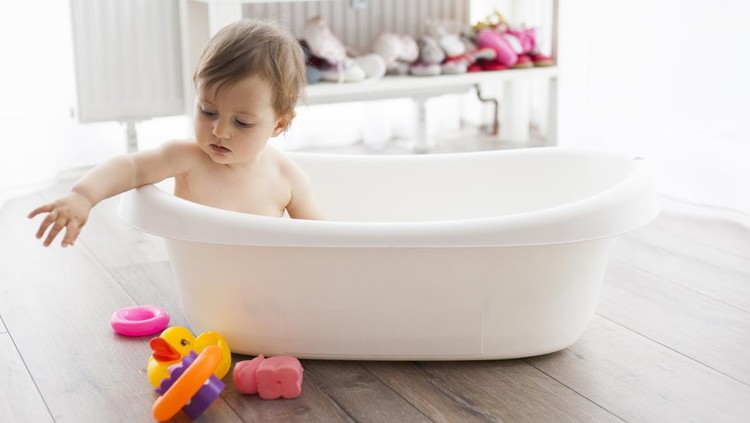 cute baby girl taking bath
