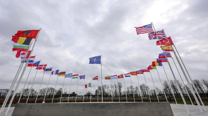 FILE - Flags of NATO member countries flap in the wind outside NATO headquarters in Brussels, Feb. 22, 2022. As Western leaders congratulate themselves for their speedy and severe responses to Russia’s invasion of Ukraine, they’re also scratching their heads with uncertainty about what their actions will accomplish.  (AP Photo/Olivier Matthys, File)