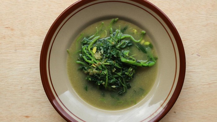Sayur Bobor Bayam or Spinach coconut milk soup is made from spinach. Indonesian homemade food
