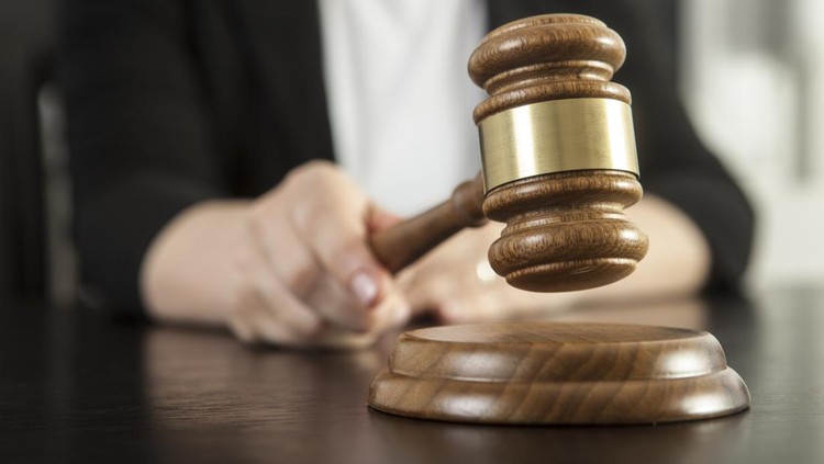 Caucasian woman holding gavel