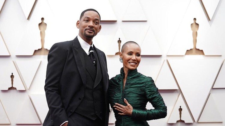 Will Smith, left, and Jada Pinkett Smith arrive at the Oscars on Sunday, March 27, 2022, at the Dolby Theatre in Los Angeles. (AP Photo/Jae C. Hong)