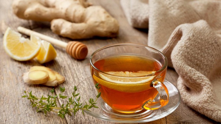 tea with ginger&comma; lemon and thyme on old wooden background